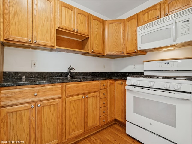 4H Locust Ct Unit H, Fishkill, NY 12524 - kitchen with white appliances, light wood-style floors, dark stone countertops, and open shelves