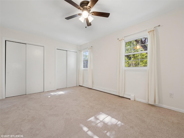 4H Locust Ct Unit H, Fishkill, NY 12524 - unfurnished bedroom featuring two closets, multiple windows, carpet floors, and ceiling fan