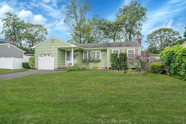 12 Pine Cone St, Middle Island, NY 11953 - ranch-style home featuring a garage, driveway, and a chimney