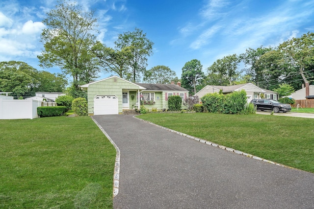 12 Pine Cone St, Middle Island, NY 11953 - view of front of property with driveway, a garage, and a chimney