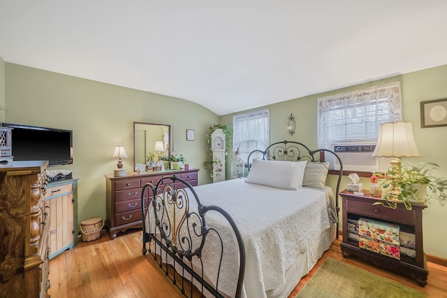 12 Pine Cone St, Middle Island, NY 11953 - bedroom featuring wood-type flooring, cooling unit, and lofted ceiling