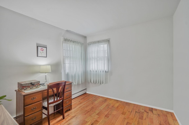 12 Pine Cone St, Middle Island, NY 11953 - office area featuring baseboard heating and light wood finished floors