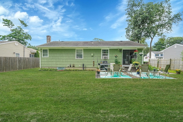 12 Pine Cone St, Middle Island, NY 11953 - back of house with a patio, a fenced backyard, and a chimney