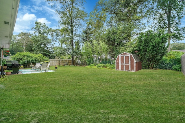 12 Pine Cone St, Middle Island, NY 11953 - fenced backyard featuring a storage shed and a patio