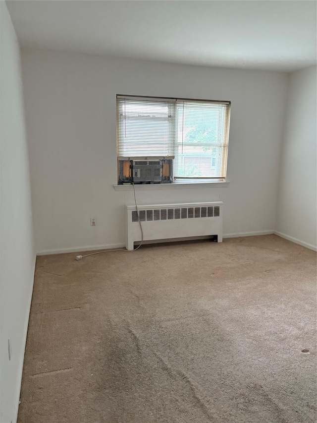 68 Loring Ave, Yonkers, NY 10704 - empty room with radiator, carpet, and cooling unit