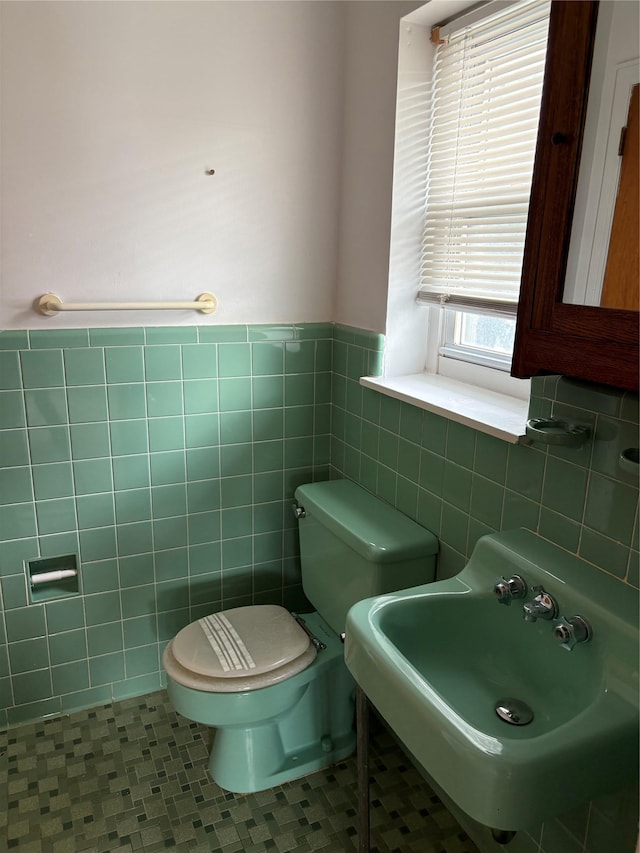 68 Loring Ave, Yonkers, NY 10704 - half bath featuring tile walls and wainscoting