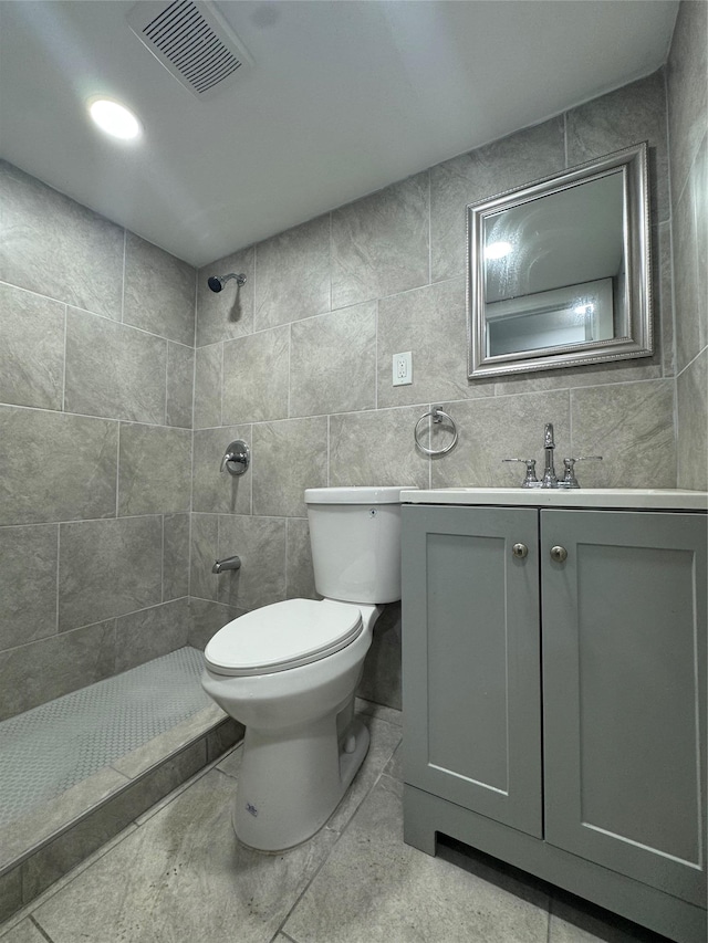1611 Research Ave, Bronx, NY 10465 - bathroom featuring a tile shower, vanity, and tile walls