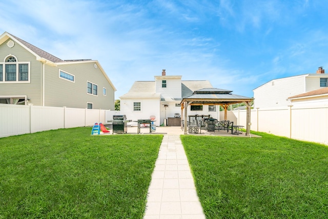 14 Crocus Ct, West Babylon, NY 11704 - rear view of property featuring a gazebo, a patio, a chimney, and a fenced backyard