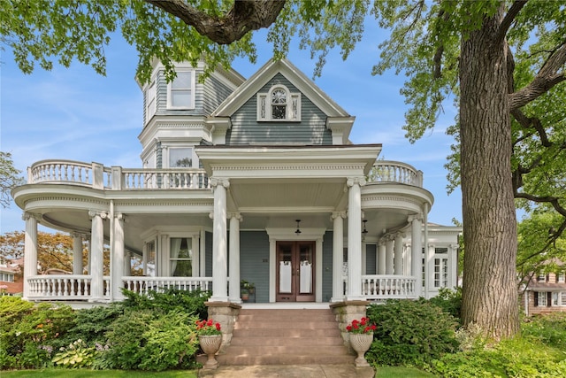28 Shore Rd, Douglaston, NY 11363 - view of front of property with covered porch, a balcony, and french doors