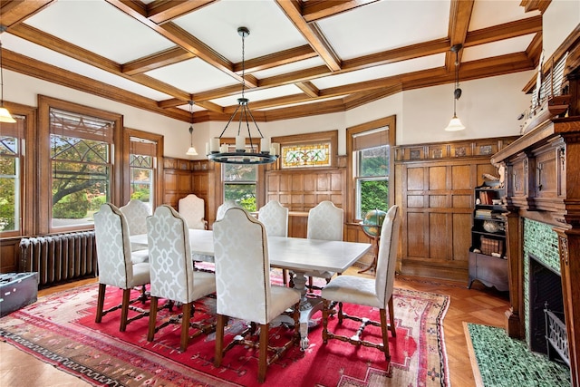 28 Shore Rd, Douglaston, NY 11363 - dining room with radiator, healthy amount of natural light, a high end fireplace, a chandelier, and ornamental molding
