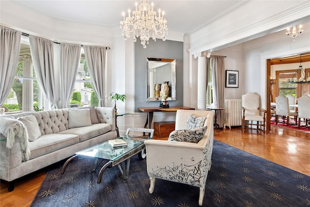 28 Shore Rd, Douglaston, NY 11363 - living room with radiator heating unit, a chandelier, and crown molding
