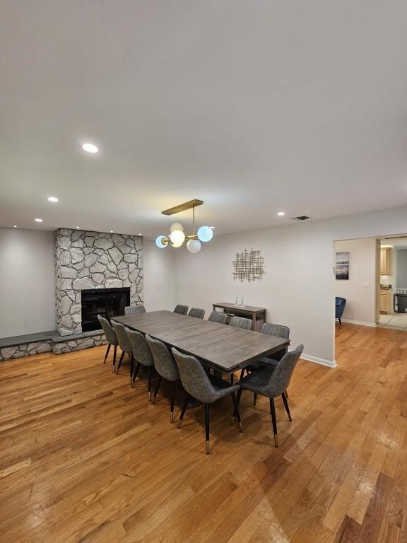 11 Cliff Ct, Monroe, NY 10950 - dining space with light wood-style flooring, a fireplace, and recessed lighting