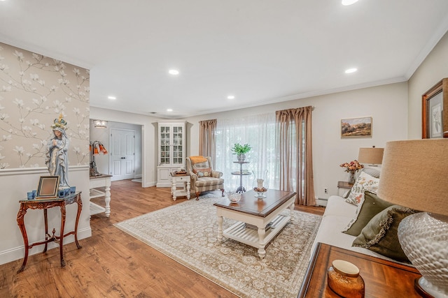 6 Memas Ct, Dix Hills, NY 11746 - living area featuring light wood-style flooring, recessed lighting, a baseboard heating unit, and ornamental molding