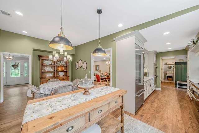 6 Memas Ct, Dix Hills, NY 11746 - kitchen featuring a chandelier, light wood-style flooring, hanging light fixtures, light countertops, and recessed lighting