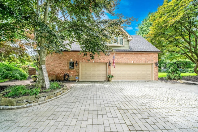 6 Memas Ct, Dix Hills, NY 11746 - view of property exterior featuring decorative driveway, brick siding, a shingled roof, and a garage