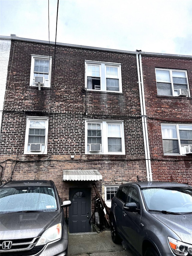 82-13 32nd Ave, East Elmhurst, NY 11370 - view of property with brick siding and cooling unit