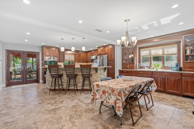 20 Tulipwood Dr, Commack, NY 11725 - dining room featuring a chandelier, healthy amount of natural light, light stone finish floors, recessed lighting, and ornamental molding