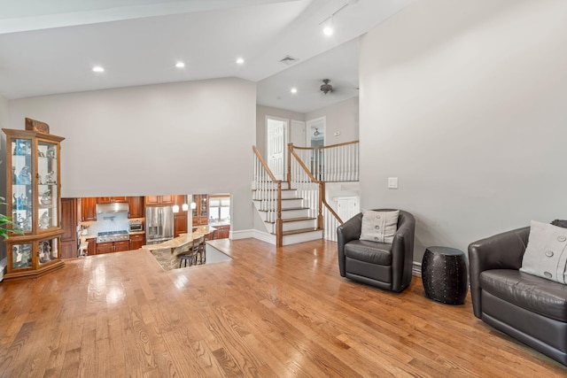 20 Tulipwood Dr, Commack, NY 11725 - living room featuring high vaulted ceiling, stairs, light wood-type flooring, and recessed lighting