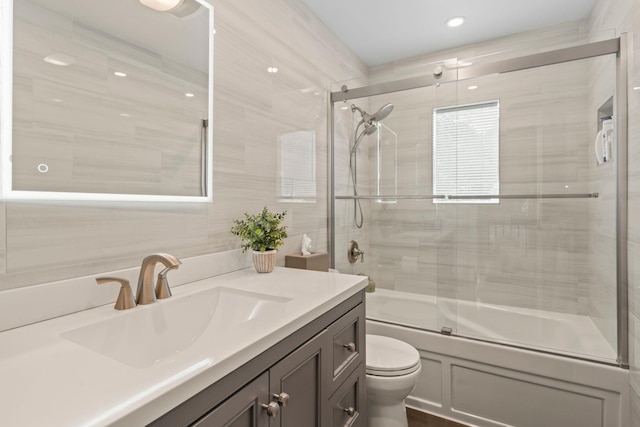 20 Tulipwood Dr, Commack, NY 11725 - full bathroom featuring vanity, shower / bath combination with glass door, and tile walls