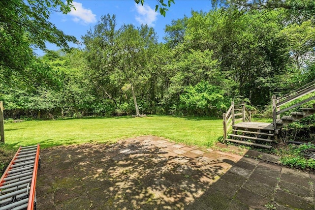 11 Bertha St, East Patchogue, NY 11772 - view of grassy yard featuring stairs and a patio area