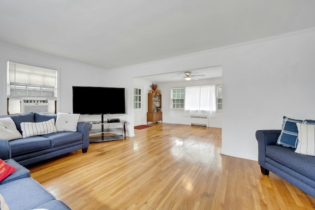 118 Robins Rd Unit 118, New Rochelle, NY 10801 - living area with ornamental molding, radiator, wood finished floors, a ceiling fan, and cooling unit