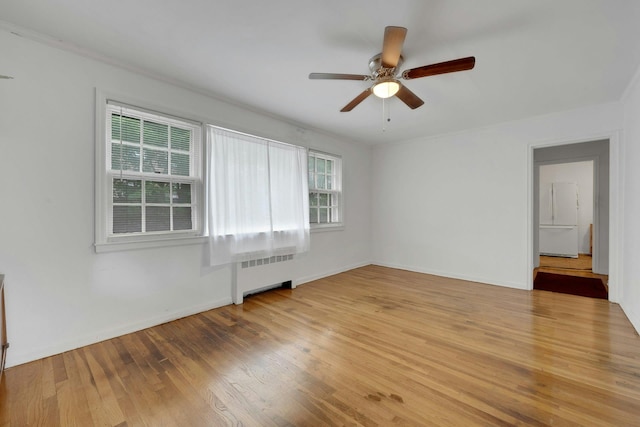 118 Robins Rd Unit 118, New Rochelle, NY 10801 - unfurnished room with radiator, light wood finished floors, and ceiling fan