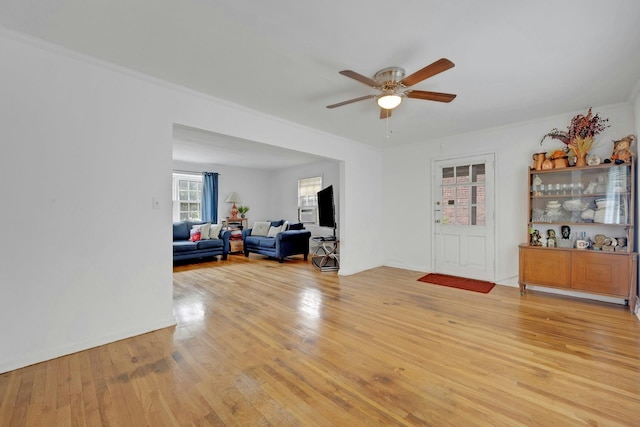 118 Robins Rd Unit 118, New Rochelle, NY 10801 - living room with ceiling fan, light wood-type flooring, and crown molding
