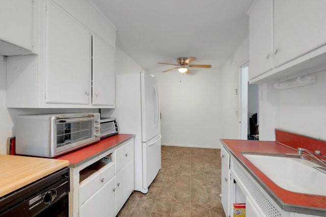 118 Robins Rd Unit 118, New Rochelle, NY 10801 - kitchen with black dishwasher, ceiling fan, and white cabinets