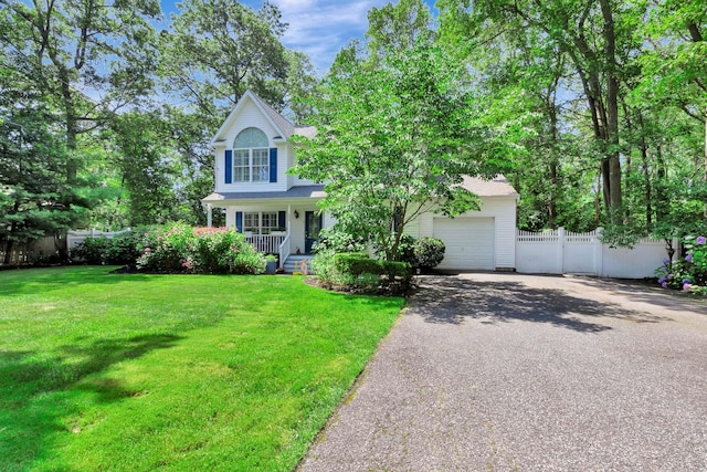 224 Moriches Middle Island Rd, Shirley, NY 11967 - obstructed view of property featuring asphalt driveway, covered porch, and an attached garage