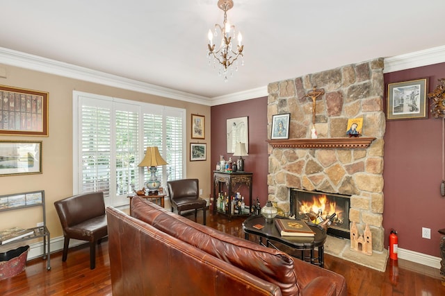224 Moriches Middle Island Rd, Shirley, NY 11967 - living room with wood finished floors, a chandelier, crown molding, and a stone fireplace