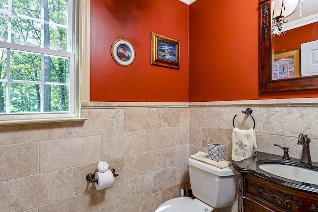 224 Moriches Middle Island Rd, Shirley, NY 11967 - bathroom featuring vanity, a wainscoted wall, tile walls, and crown molding
