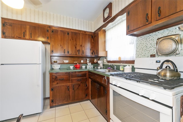 2 Nautilus Ave, Plainview, NY 11803 - kitchen featuring white appliances, wallpapered walls, light tile patterned flooring, brown cabinets, and ceiling fan