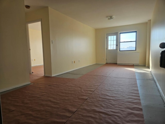 87-30 62nd Ave Unit 7F, Rego Park, NY 11374 - empty room with a smoke detector and baseboards