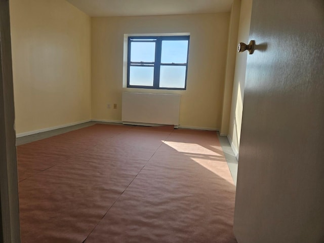 87-30 62nd Ave Unit 7F, Rego Park, NY 11374 - empty room featuring radiator and baseboards