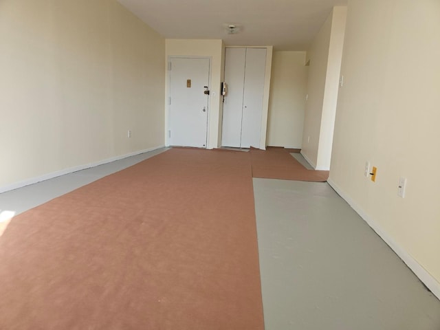 87-30 62nd Ave Unit 7F, Rego Park, NY 11374 - spare room with baseboards and finished concrete flooring
