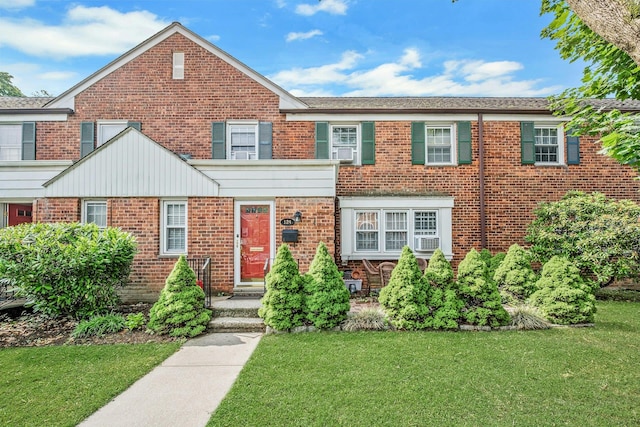124 Robins Unit 124, New Rochelle, NY 10801 - view of front of property featuring a front yard, brick siding, and cooling unit