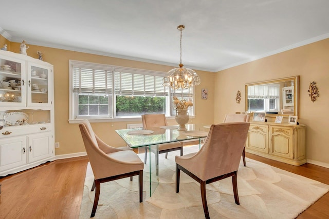 124 Robins Unit 124, New Rochelle, NY 10801 - dining area with plenty of natural light, light wood finished floors, a chandelier, and crown molding