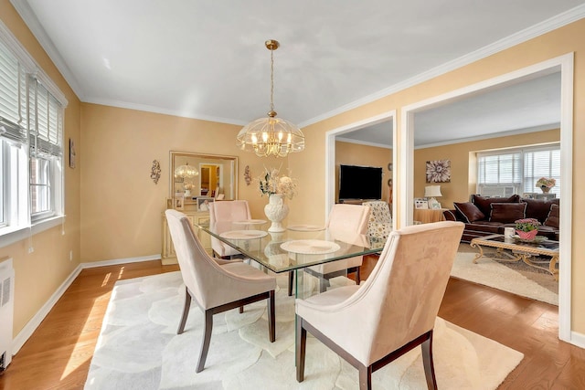 124 Robins Unit 124, New Rochelle, NY 10801 - dining space with a chandelier, wood finished floors, crown molding, and radiator heating unit