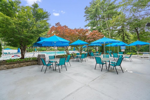 42 Richmond Blvd Unit 3B, Ronkonkoma, NY 11779 - view of patio with a community pool and view of scattered trees