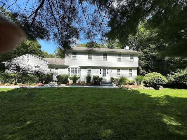233 Upper Shad Rd, Pound Ridge, NY 10576 - rear view of property with a chimney and a lawn