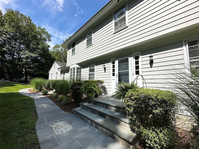 233 Upper Shad Rd, Pound Ridge, NY 10576 - doorway to property with a lawn