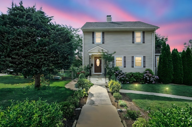 27 S Goodwin Ave, Elmsford, NY 10523 - view of front of home featuring a front yard and a chimney