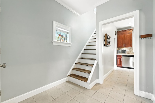 27 S Goodwin Ave, Elmsford, NY 10523 - staircase featuring tile patterned flooring and crown molding