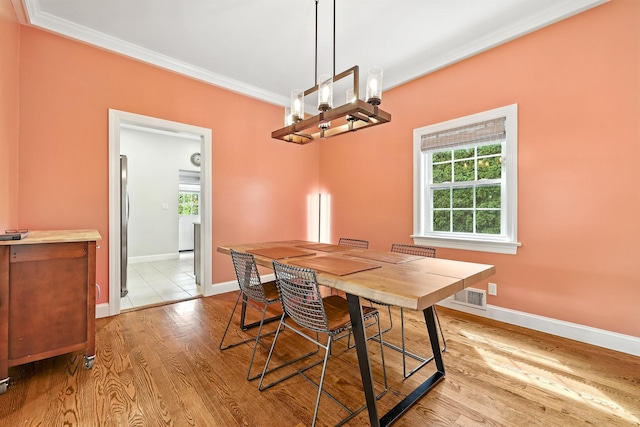 27 S Goodwin Ave, Elmsford, NY 10523 - dining area featuring ornamental molding, light wood finished floors, and a chandelier