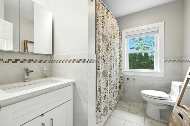 27 S Goodwin Ave, Elmsford, NY 10523 - bathroom with tile walls, vanity, a shower with shower curtain, and marble finish floors