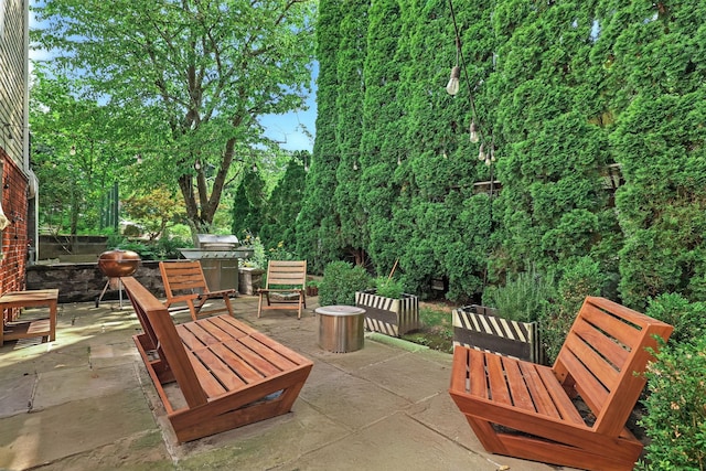 27 S Goodwin Ave, Elmsford, NY 10523 - view of patio / terrace featuring an outdoor fire pit