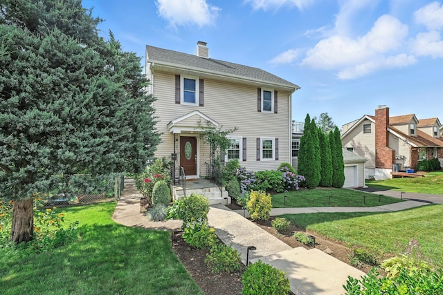 27 S Goodwin Ave, Elmsford, NY 10523 - view of front of house with a front lawn and a chimney