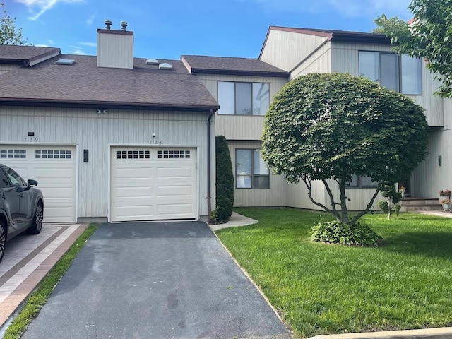 728 Woodland Estates Dr, Baldwin, NY 11510 - multi unit property with a chimney, a front lawn, a garage, a shingled roof, and driveway