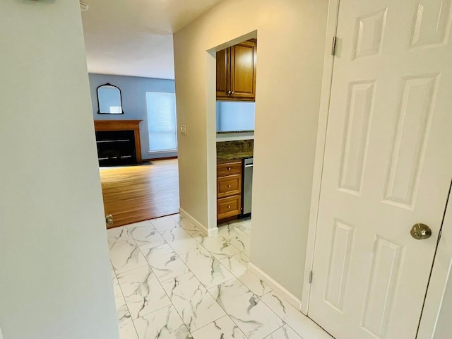 728 Woodland Estates Dr, Baldwin, NY 11510 - hall featuring light marble finish flooring and baseboards