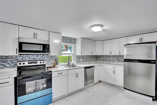 104 Schmidt Ave, Holbrook, NY 11741 - kitchen with appliances with stainless steel finishes, light marble finish flooring, and backsplash